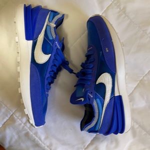 Blue Nike running shoes. Size 8 never worn $50